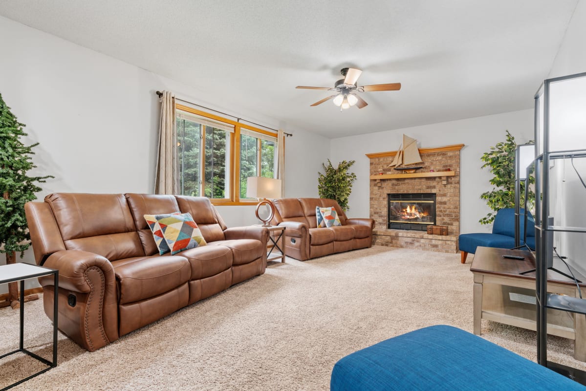 Sink into luxurious leather seating while the fireplace creates warmth and ambiance for your perfect evening retreat.