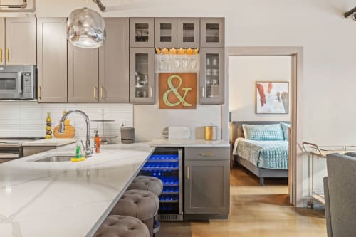Unwind in your modern kitchen with sleek appliances and stylish pendant lighting, flowing seamlessly into your cozy bedroom retreat.