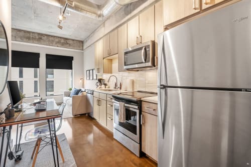 Your modern kitchen features sleek stainless steel appliances and warm wood cabinets, perfect for preparing meals during your stay.