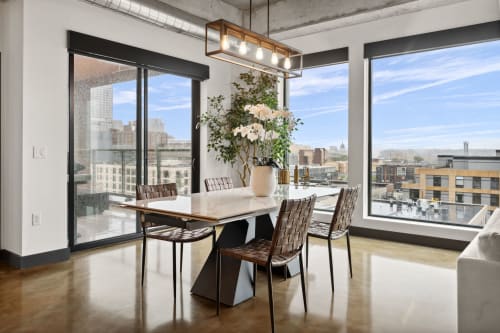 Gather around your stylish dining table bathed in natural light, with stunning city views creating the perfect backdrop for memorable meals.